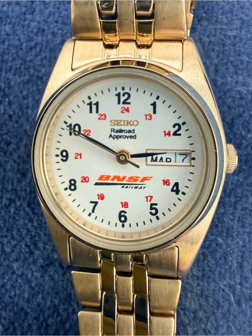 Seiko BNSF-Approved Gold-Tone Watch with White Dial and Red Accents